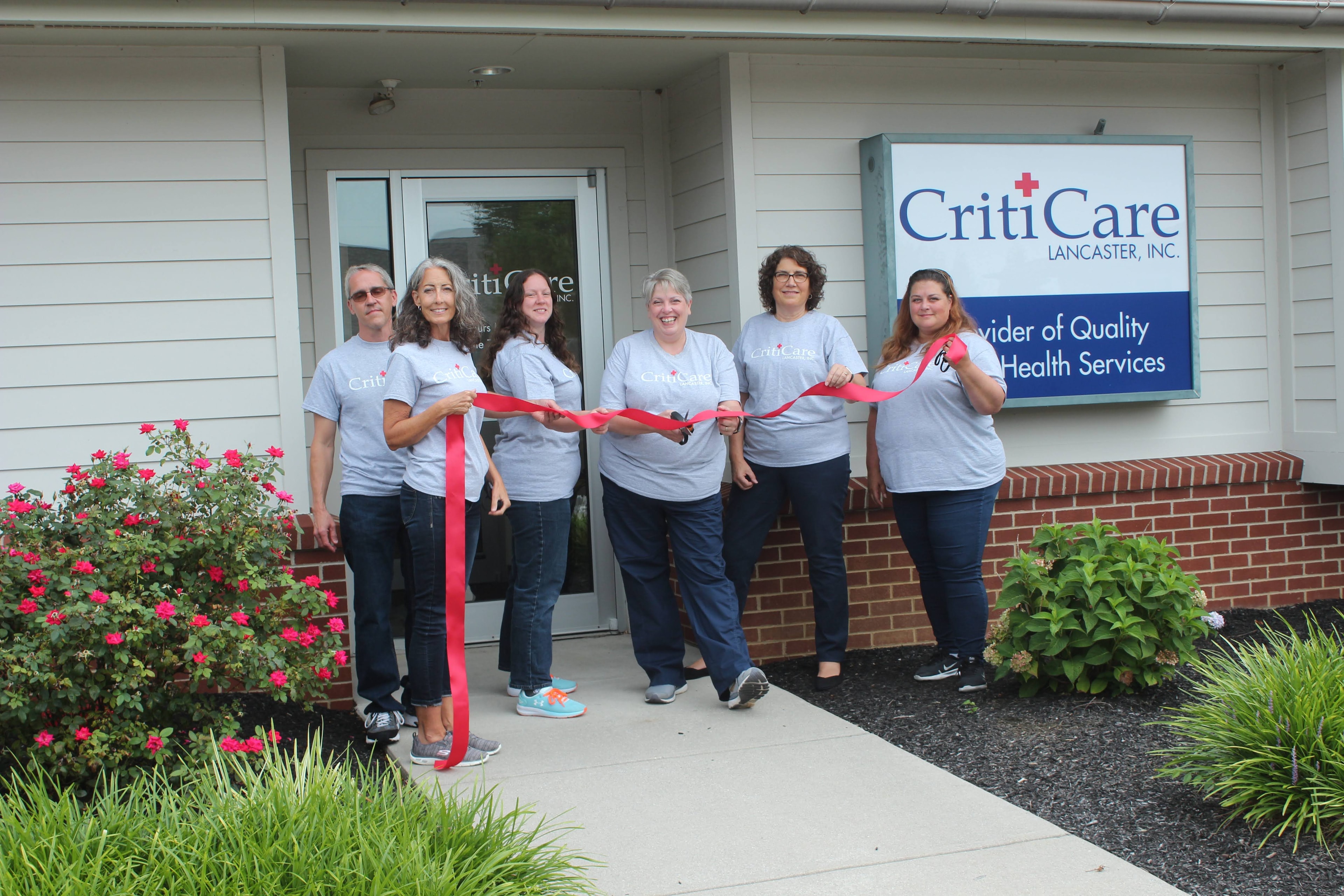 CritiCare team at ribbon-cutting celebration