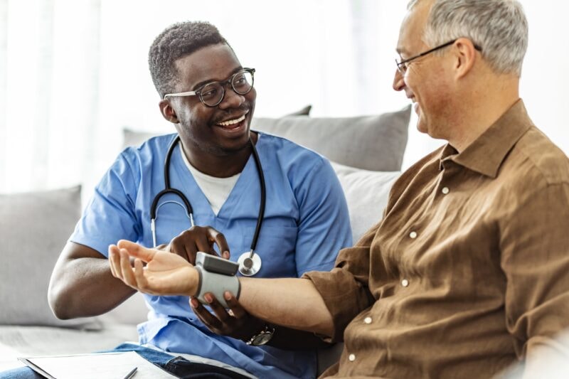 Adult home care nurse with patient