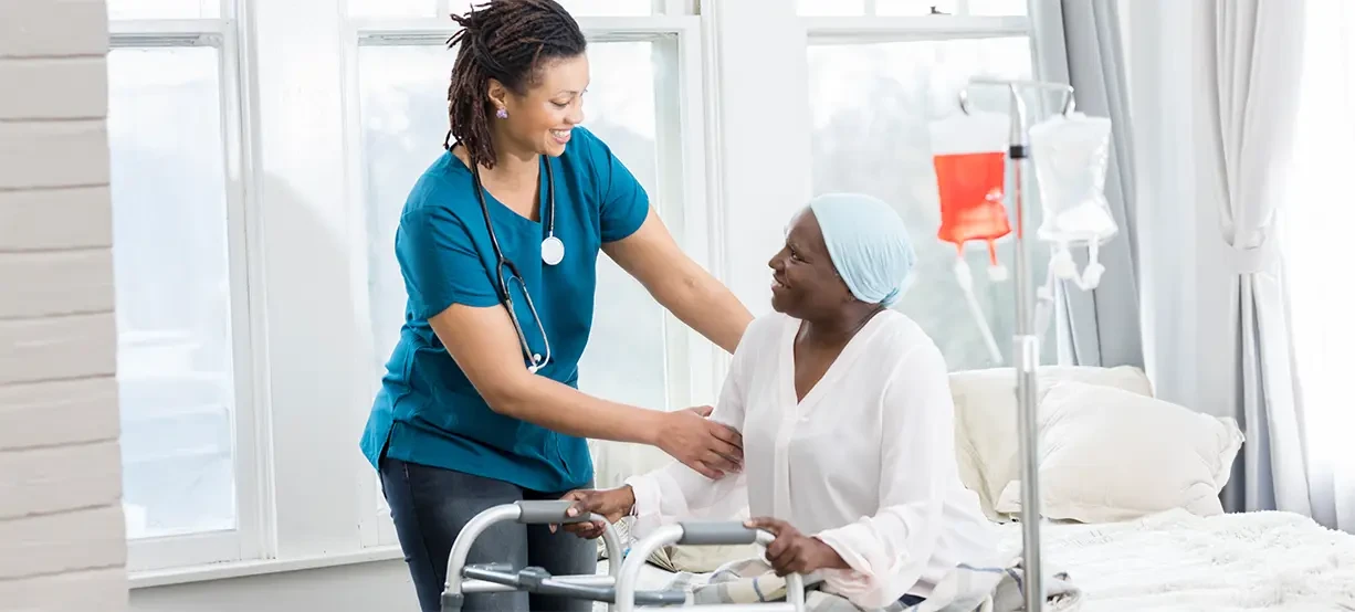 Nurse providing IV infusion therapy to patient