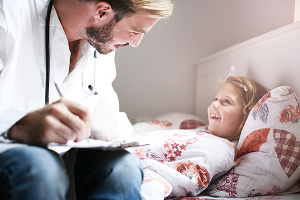 pediatric nurse examining child